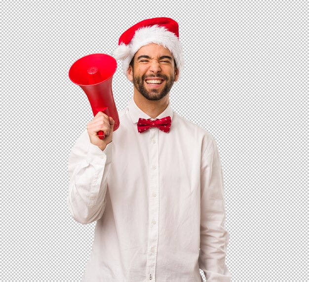 Giovane che porta un cappello del Babbo Natale il giorno di Natale