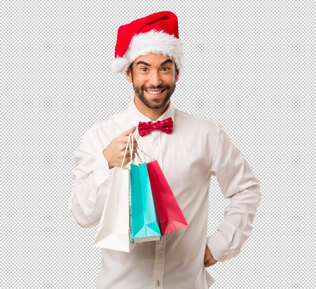 Giovane che porta un cappello del Babbo Natale il giorno di Natale