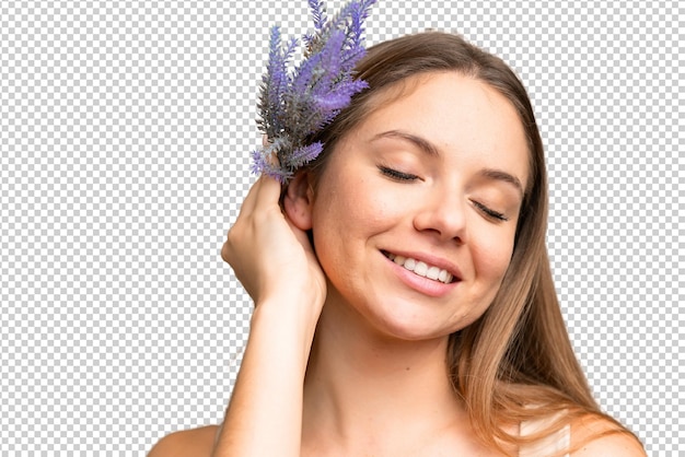 Giovane donna bionda su uno sfondo a chiave cromatica isolato con in mano una pianta di lavanda Ritratto in primo piano
