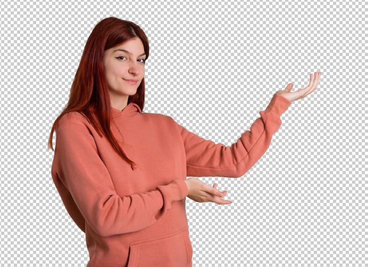 PSD giovane ragazza rossa con felpa rosa che estende le mani sul lato