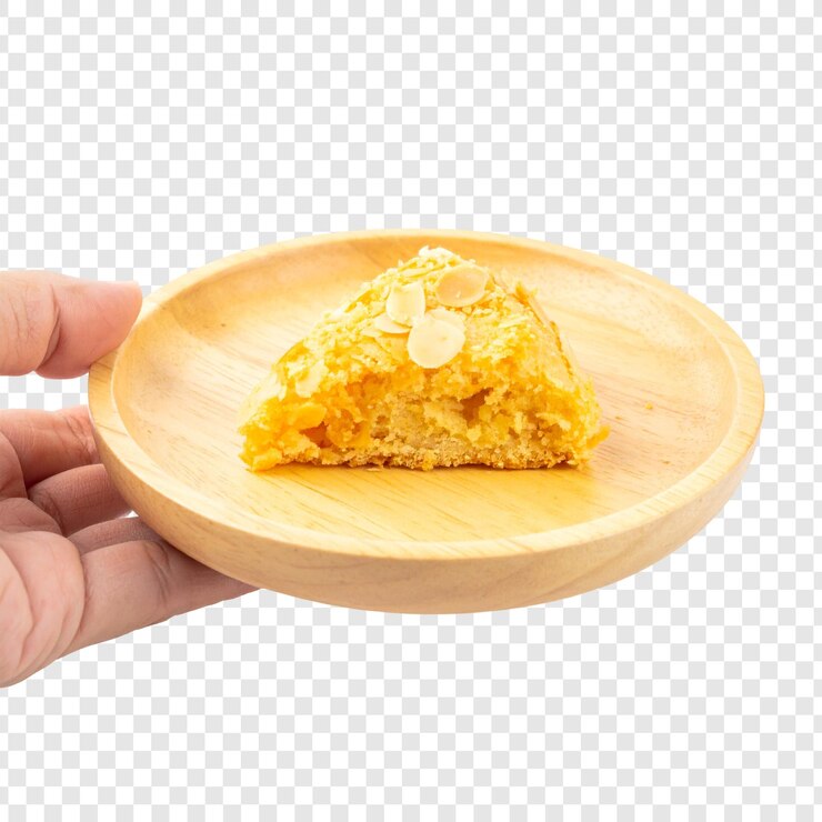 PSD golden yellow pastry slice on wooden plate