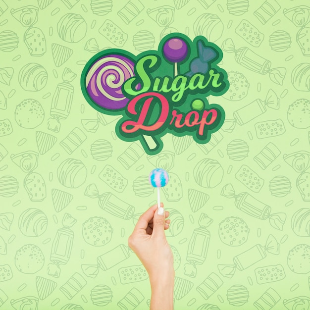 Gota de azúcar con mano y fondo verde doodle