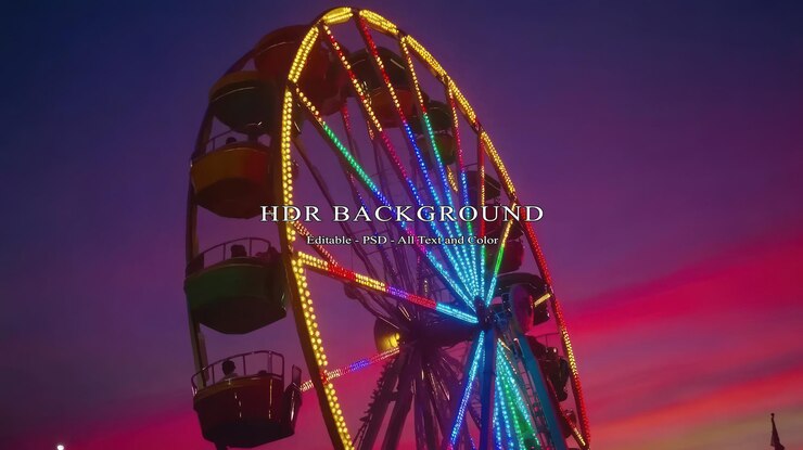 PSD la grande roue éclairée contre le coucher de soleil vibrant