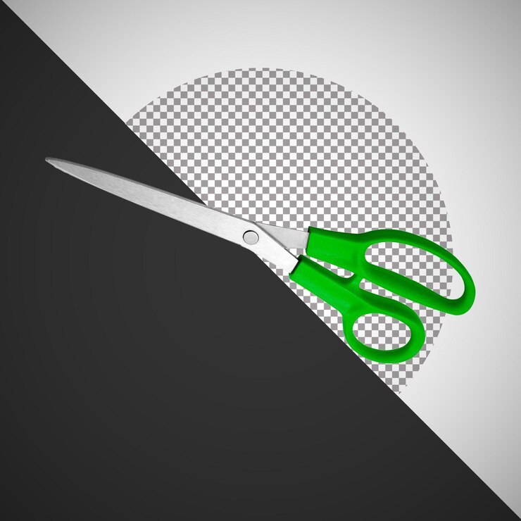 PSD green handled scissors isolated on a white and black background
