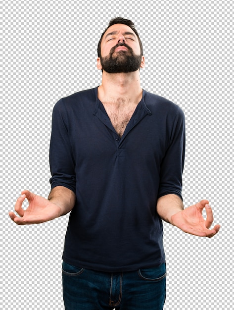 Gut aussehender Mann mit Bart in Zen-Position