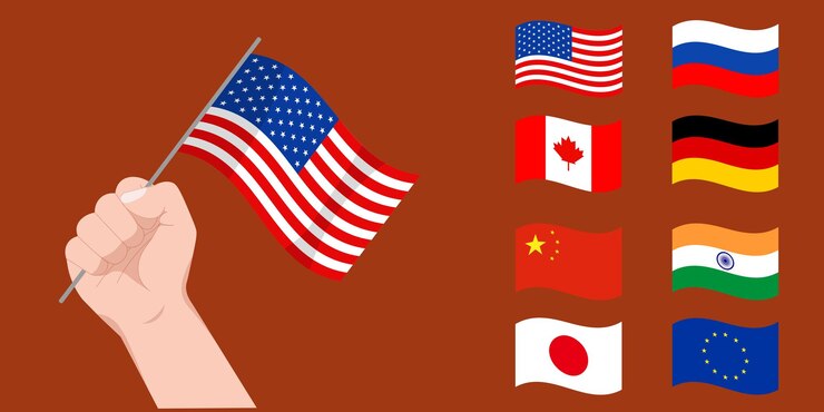 PSD hand holding american flag with various country flags on brown background