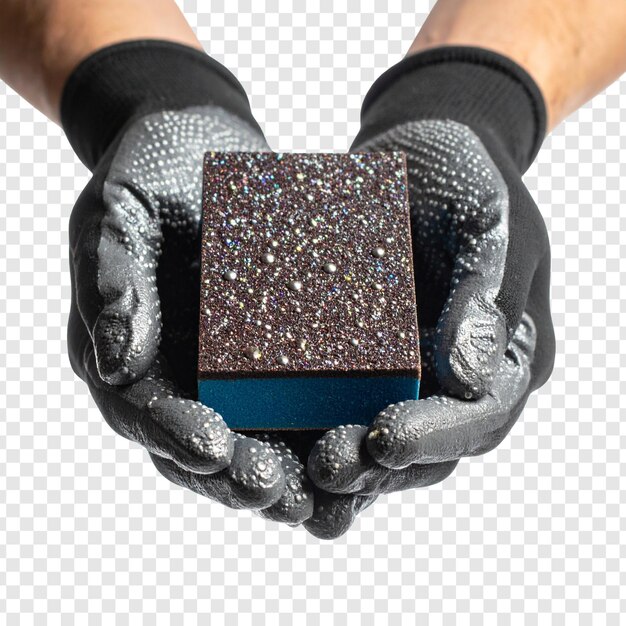 Hands in gloves holding a dark gray and blue rectangular object