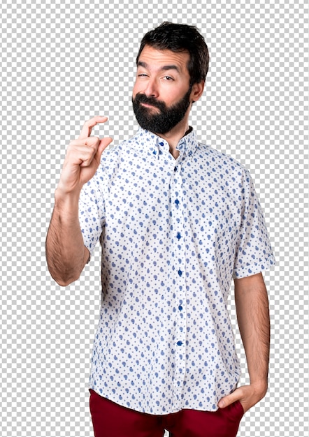 Hermoso morena hombre con barba haciendo signo diminuto