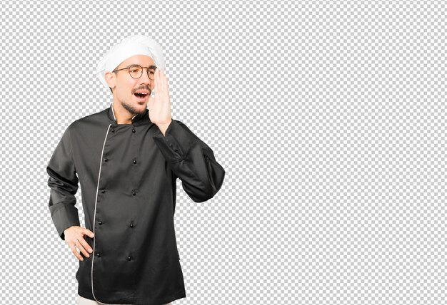 Heureux jeune chef essayant de dire quelque chose de fort