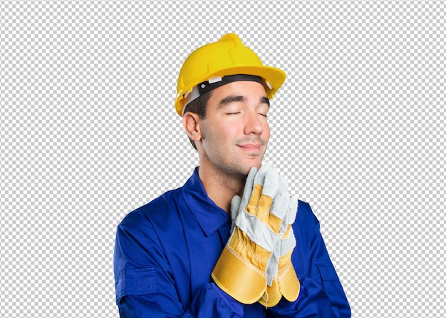 Hoffnungsvolle Arbeitskraft, die auf weißem Hintergrund betet