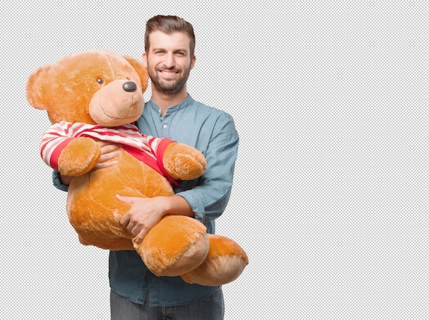 Hombre atractivo joven con peluche