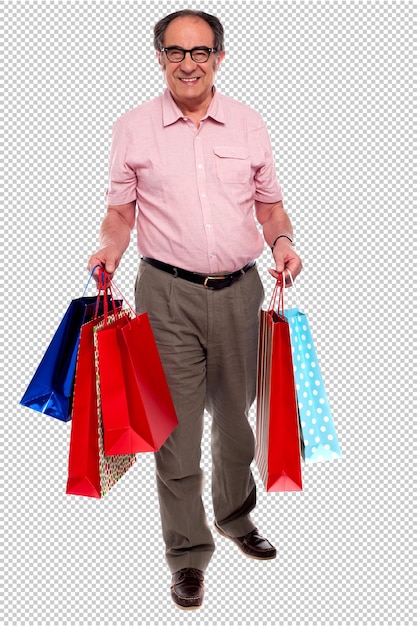un hombre con bolsas de compras en sus manos
