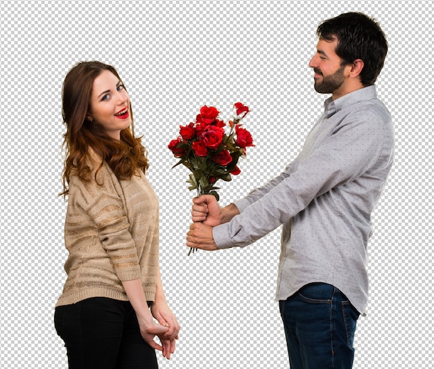 Hombre dando flores a una niña