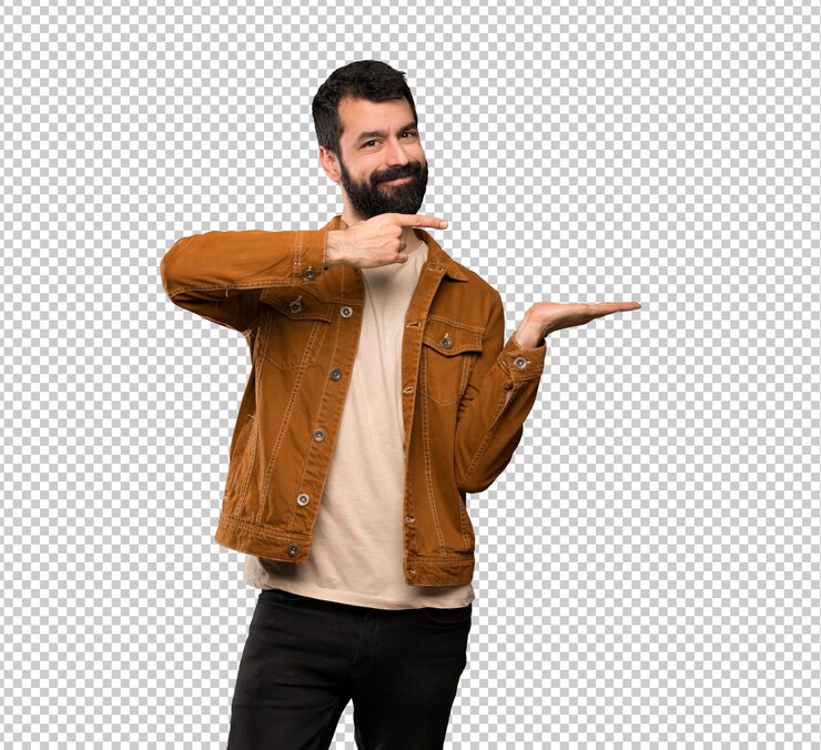 PSD hombre guapo con barba sosteniendo copyspace imaginario en la palma para insertar un anuncio