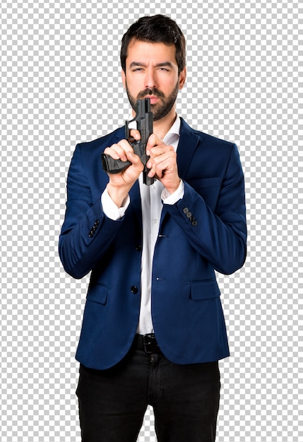Hombre guapo sosteniendo una pistola