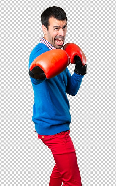 Hombre joven hermoso con los guantes de boxeo