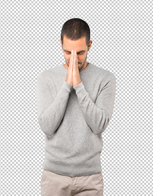 Hombre joven preocupado rezando gesto