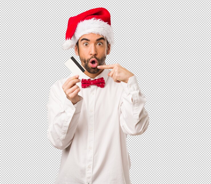 PSD hombre joven que lleva un sombrero de papá noel el día de navidad