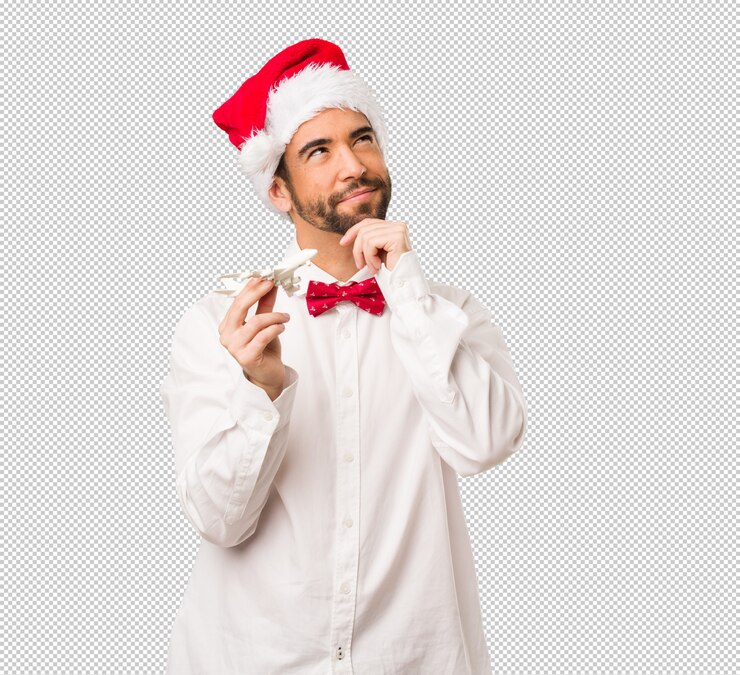 PSD hombre joven que lleva un sombrero de papá noel el día de navidad