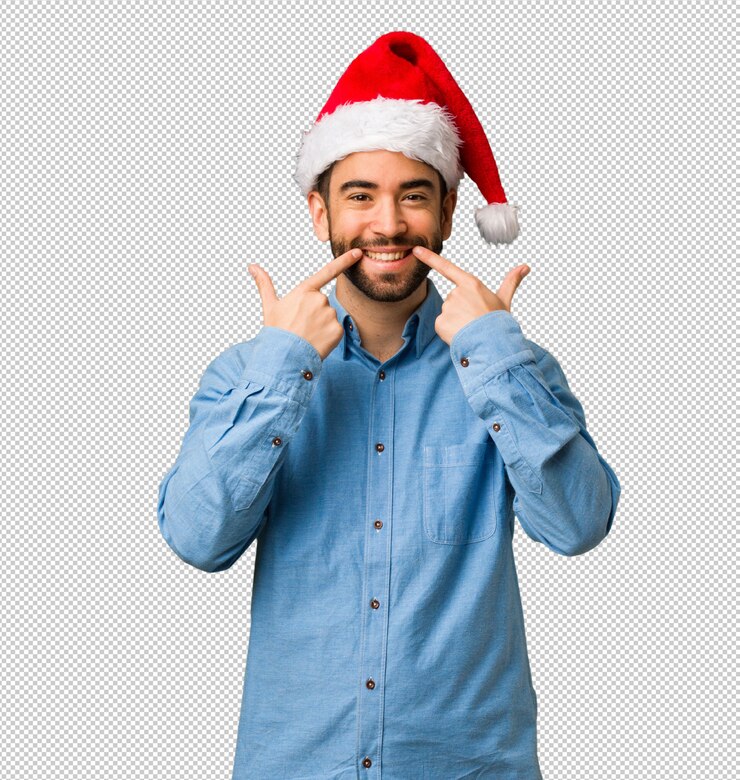 PSD hombre joven con sonrisas de sombrero de santa, señalando la boca