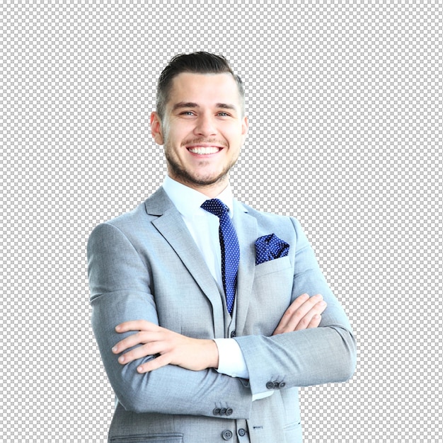 Un hombre de negocios confiado en un traje gris sonriendo con los brazos cruzados