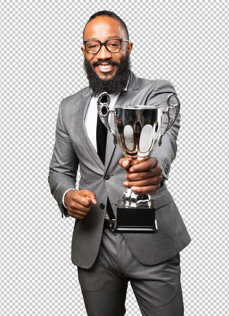 Hombre negro de negocios sosteniendo un trofeo