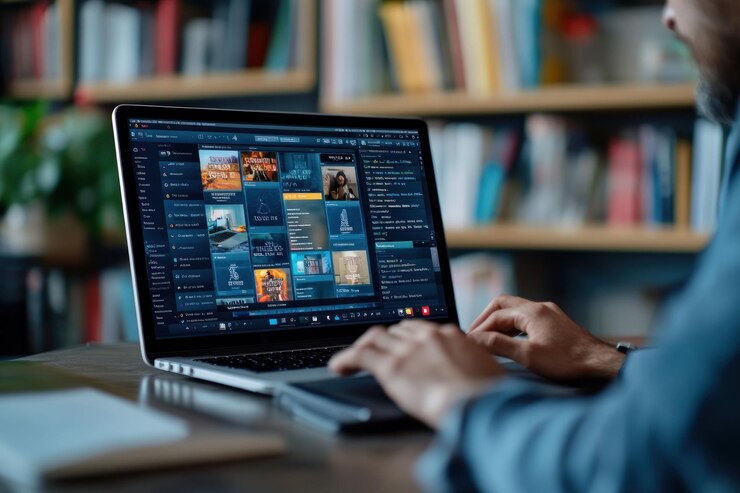 PSD hombre trabajando en una computadora portátil con software de diseño gráfico en un entorno de biblioteca