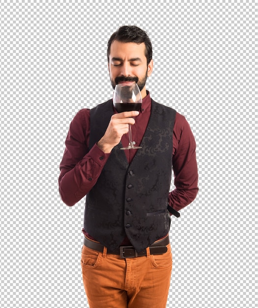 PSD hombre vestido con chaleco sosteniendo una copa de vino