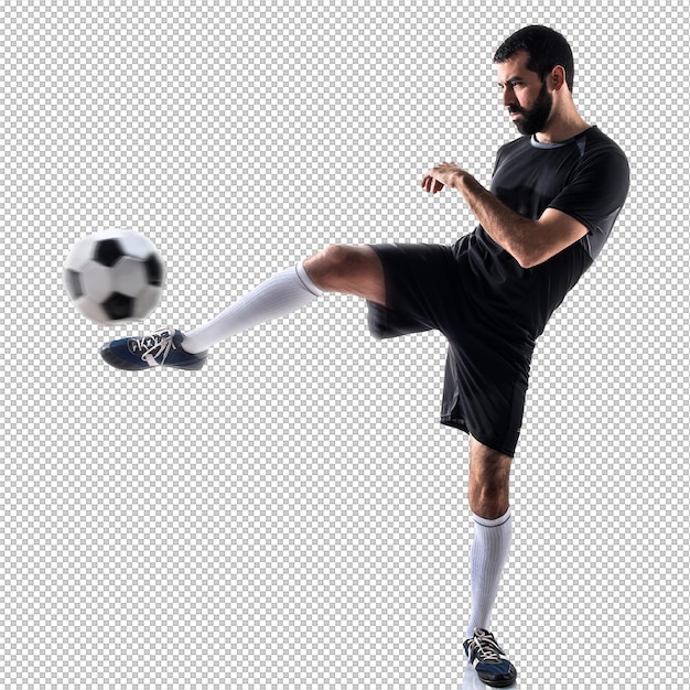 Homem a jogar futebol.