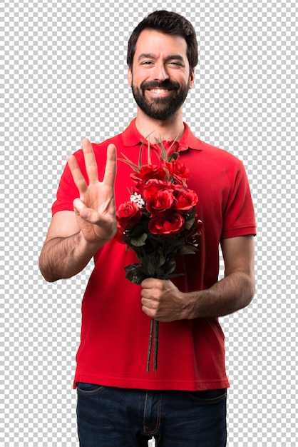 Homem bonito segurando flores contando três