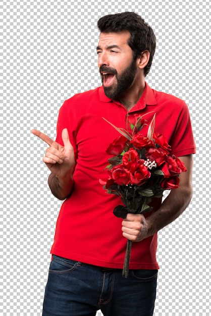 Homem bonito segurando flores dançando