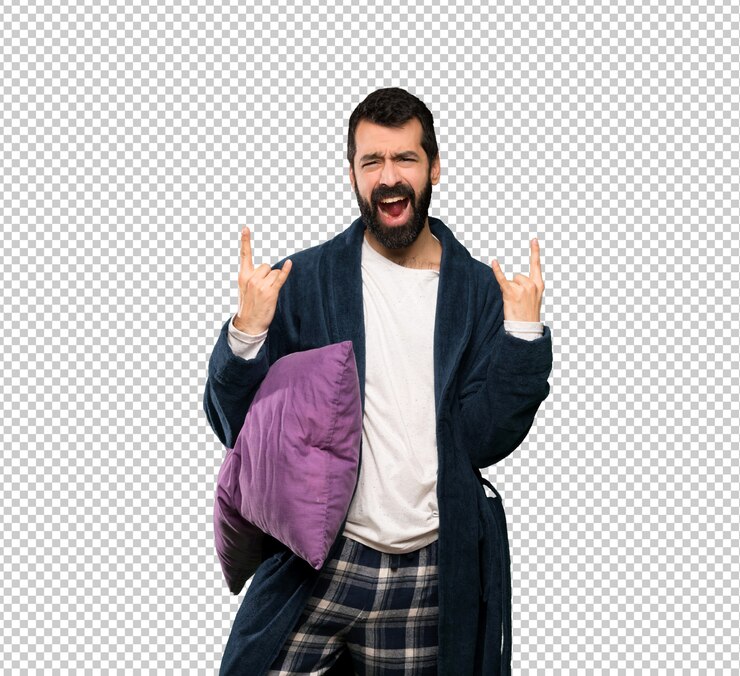 PSD homem com barba de pijama, fazendo gesto de pedra