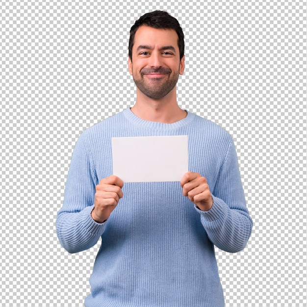 Homem com camisola azul, segurando um cartaz branco vazio para inserir um conceito