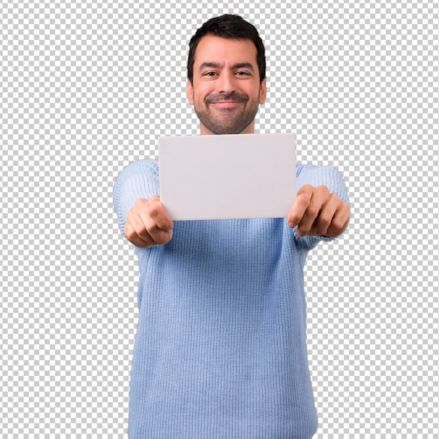 PSD homem com camisola azul, segurando um cartaz branco vazio para inserir um conceito