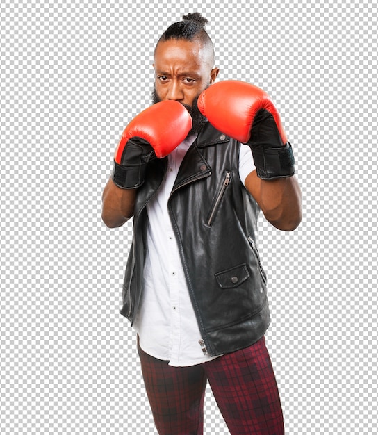 Homem negro lutando com luvas de boxe