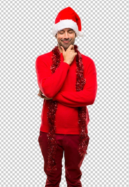 PSD homme avec des vêtements rouges célébrant les vacances de noël, regardant vers le bas avec la main sur le menton