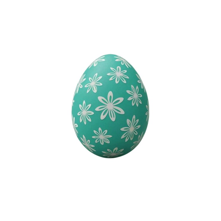Un huevo de Pascua verde con flores blancas en la parte superior