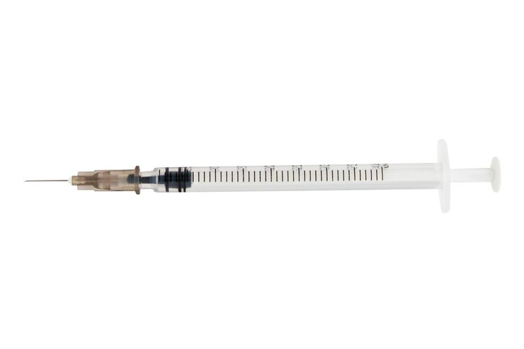 PSD insulin syringe with needle on empty background