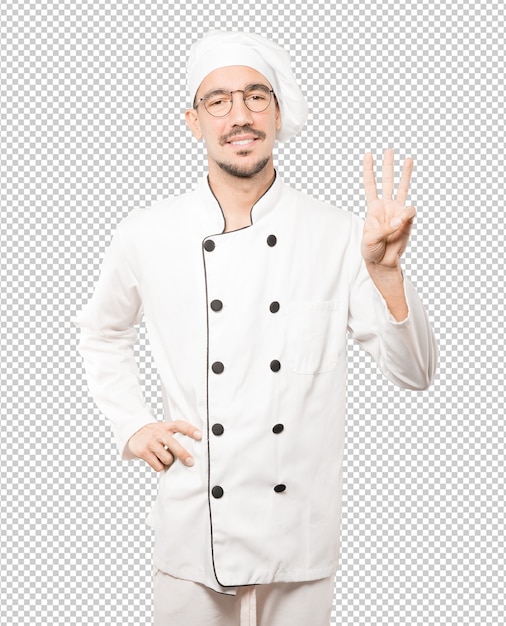 Jeune chef faisant un geste numéro trois