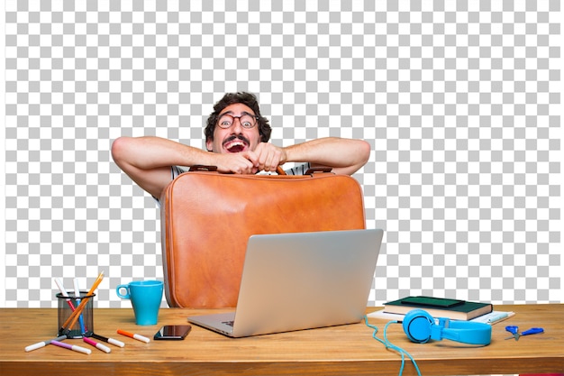 PSD jeune graphiste folle sur un bureau avec un ordinateur portable et une valise en cuir