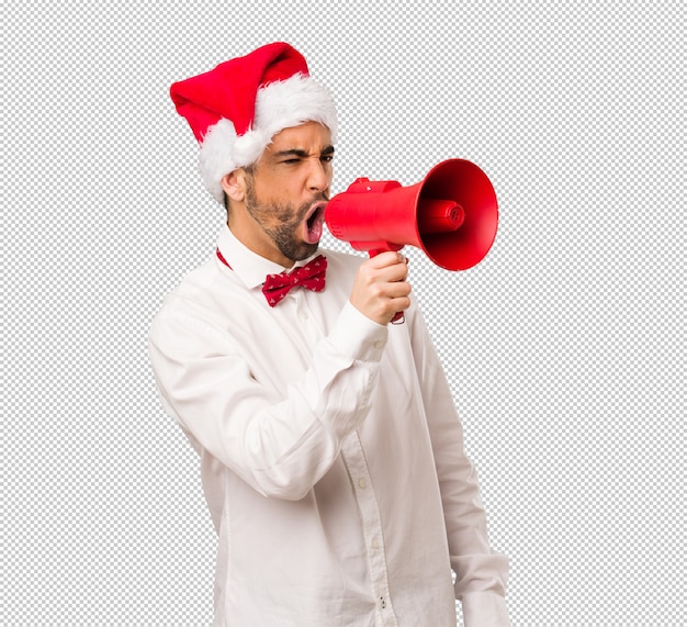 Jeune Homme Coiffé D'un Chapeau De Père Noël Le Jour De Noël