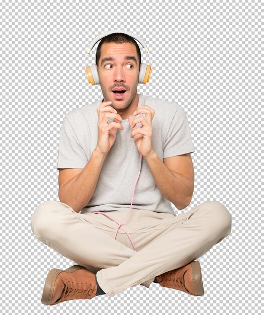 Jeune Homme En Position Assise Avec Un Geste D'inquiétude