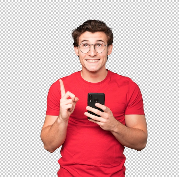 Jovem feliz apontando para cima e usando um telefone celular