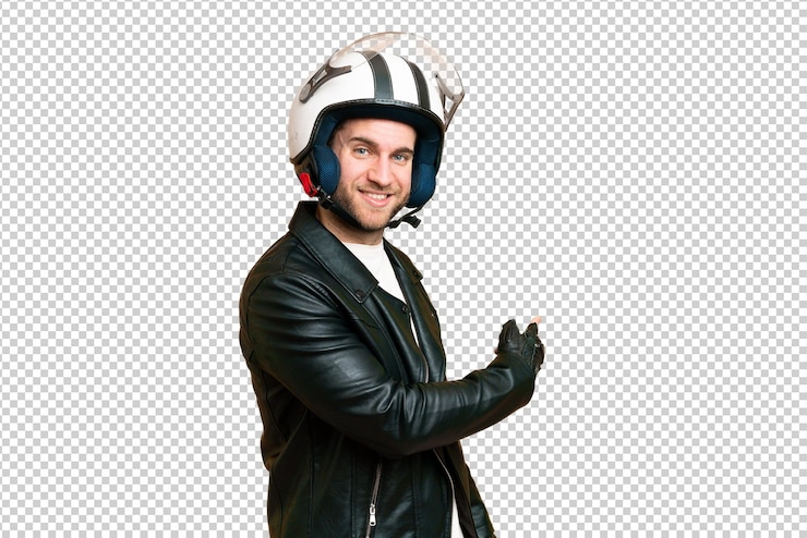 PSD jovem homem loiro bonito com um capacete de motocicleta sobre fundo de chave de croma isolado apontando para trás