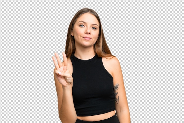 Jovem mulher loira sobre isolado chroma chave fundo feliz e contar três com os dedos
