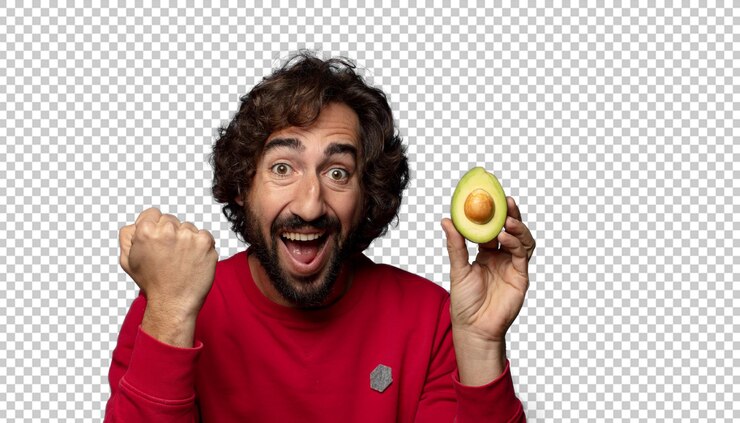 PSD joven adulto barbudo con un aguacate
