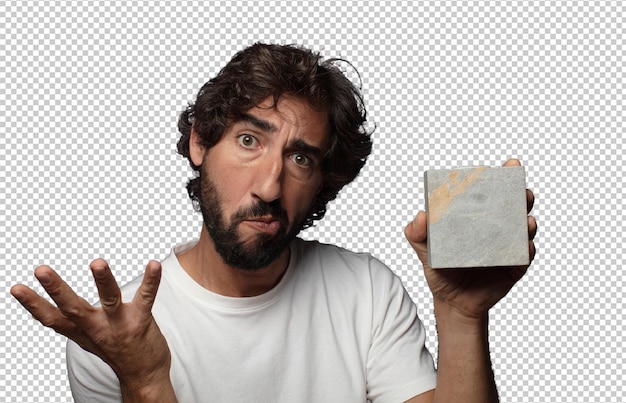 joven adulto barbudo con un ladrillo de piedra