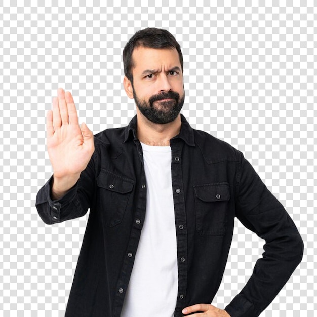 Joven con barba sobre blanco aislado haciendo un gesto de parada en un fondo transparente