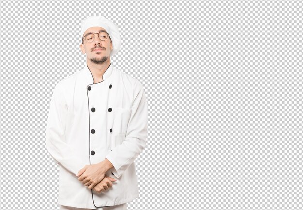 Joven chef cansado haciendo un gesto de aburrimiento