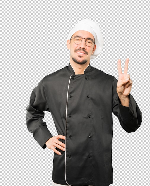 Joven chef haciendo un gesto número dos